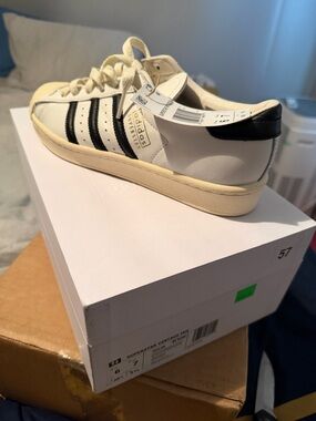 adidas White Sneakers with Black Stripes superstars very sought after shoe 250$